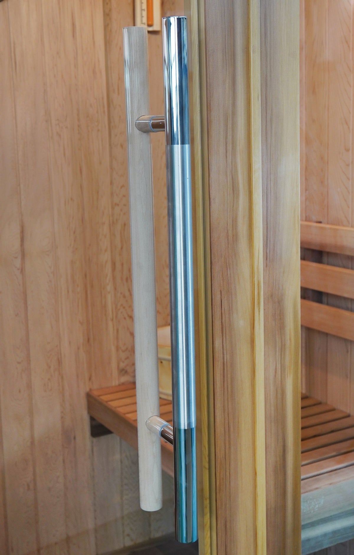 Stainless steel and wooden pull handles on either side of the SunRay Aston glass door