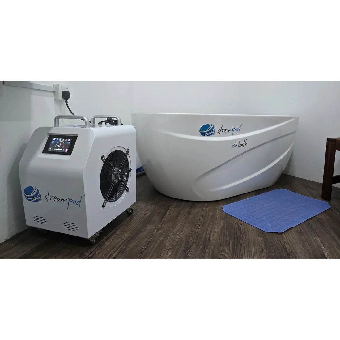 Cold plunge tub with its chiller unit installed in a home room, chiller display showing the set water temperature