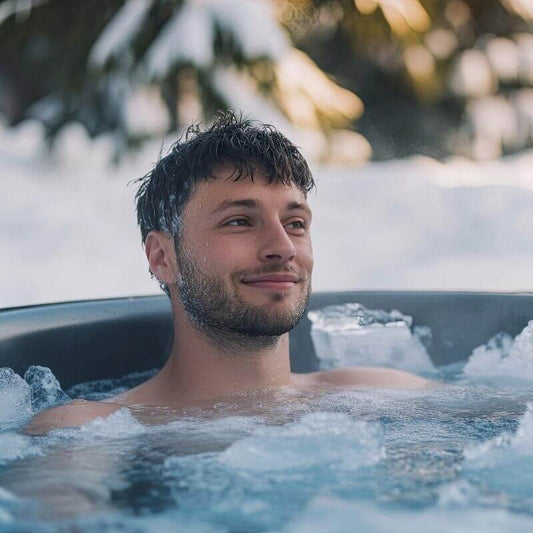 Man in a cold plunge tub outdoors — cold water immersion for athletic recovery and muscle performance