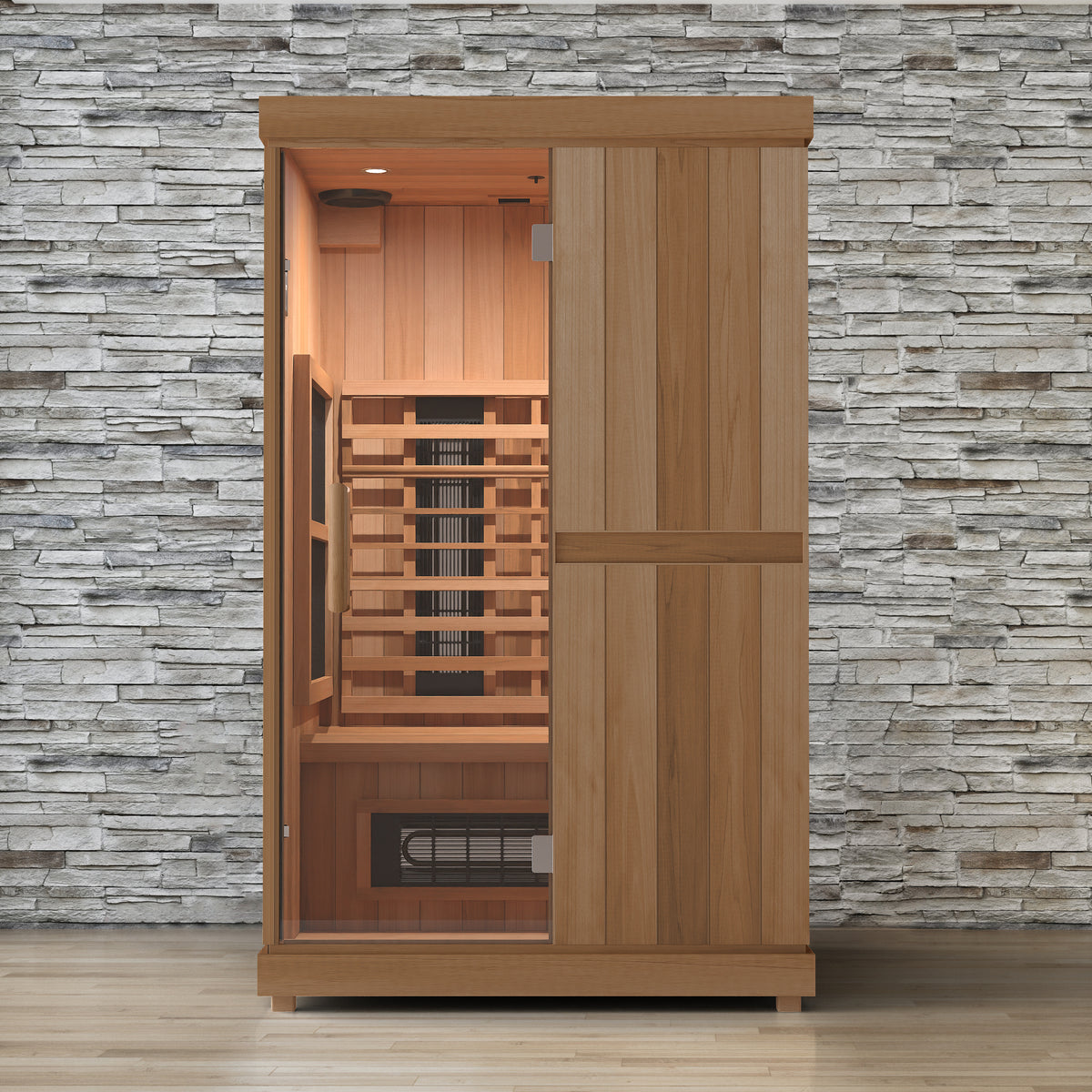 Finnmark FD-2 two person full spectrum infrared sauna lit against a stone wall, glass door on the left showing the cedar bench and infrared panels