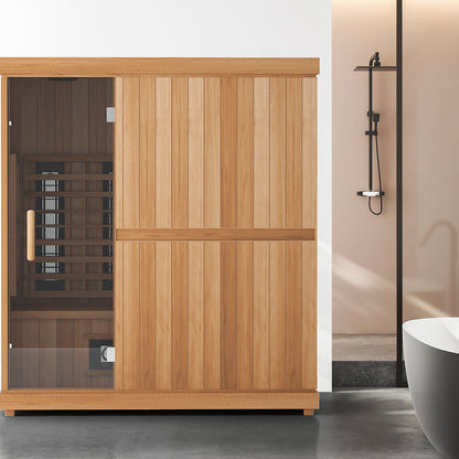 Finnmark FD-3 three to four person full spectrum infrared sauna in a bathroom beside a freestanding tub, glass door on the left