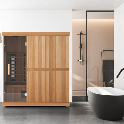 Finnmark FD-3 three to four person full spectrum infrared sauna in a bathroom beside a freestanding tub, glass door on the left