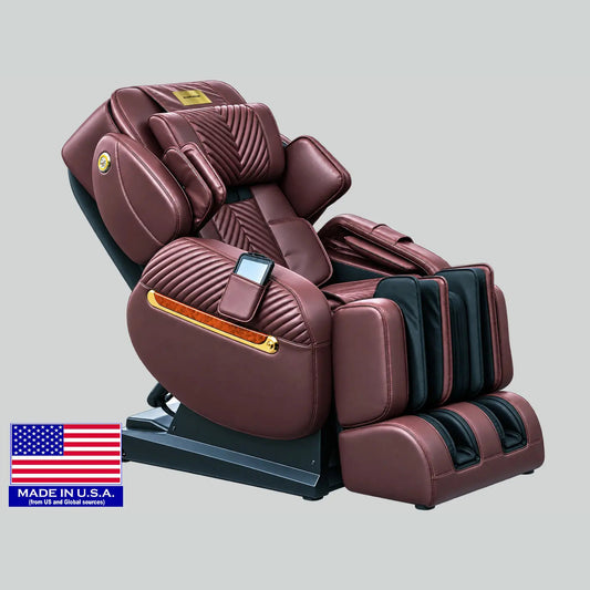 Luraco i11 Royal Edition massage chair in chocolate with 18K gold plated armrest trims and the gold name plate, with Luraco's US flag badge