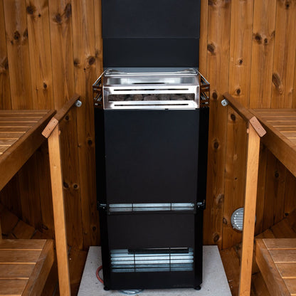 Saunum Air L 13 heater from the package between the benches of a wood sauna