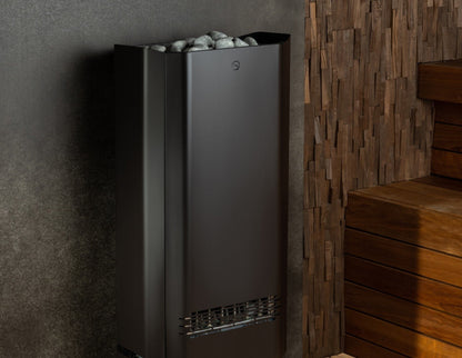 Saunum Air Perfect 10 sauna heater against a dark stone wall beside a wood bench