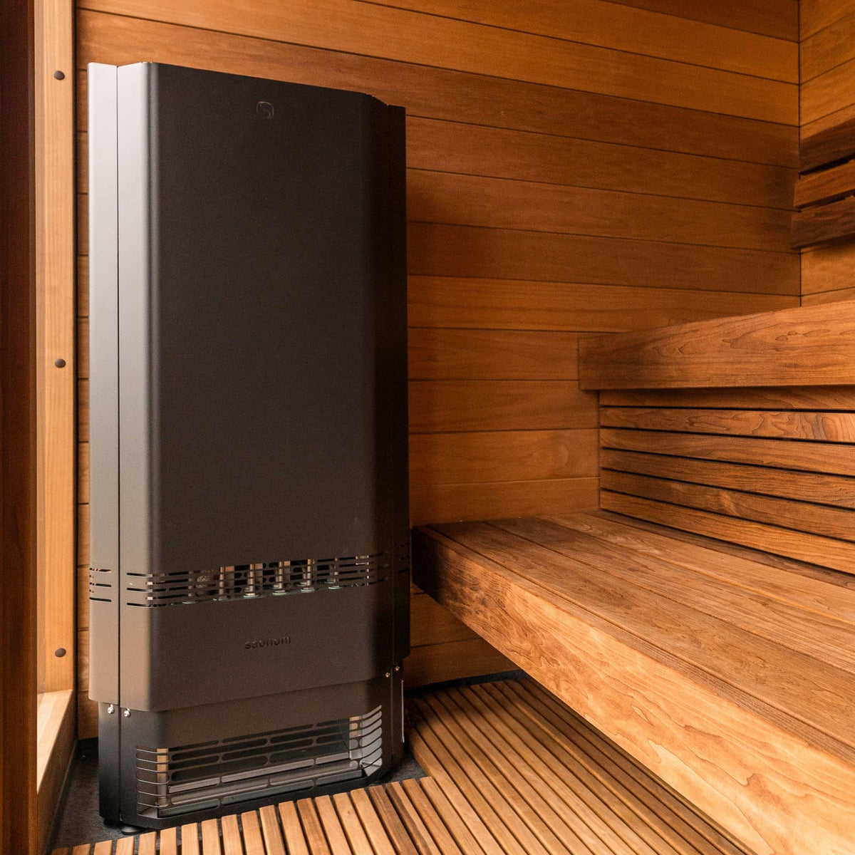 Saunum Air Perfect 7 heater from the package in the corner of a wood sauna
