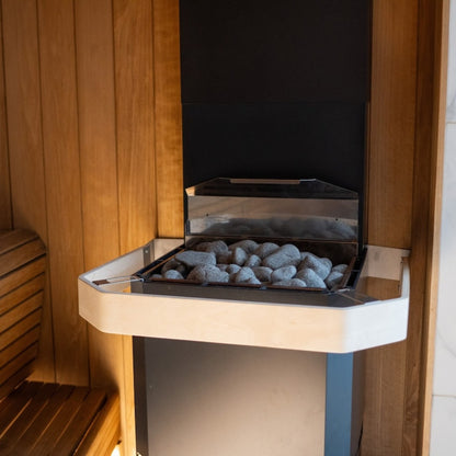 Saunum Air safety rail fitted around the stone basket of a Saunum Air heater in a sauna