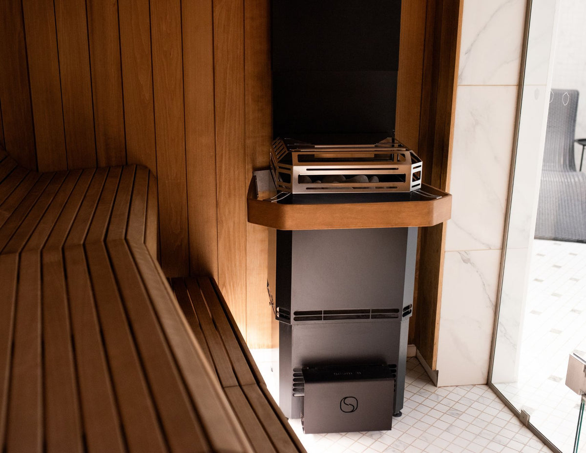Saunum Air L Safety Rail installed on a Saunum Air L heater beside a sauna bench