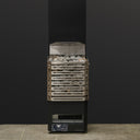 Saunum Air L 13 sauna heater with the open stainless steel basket filled with stones