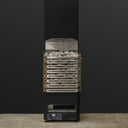 Saunum Air L 15 heater from the package with the open stainless steel basket filled with stones