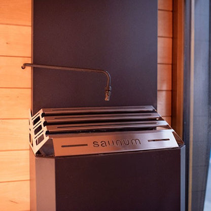 Saunum AutoLeil pipe installed over a Saunum heater basket