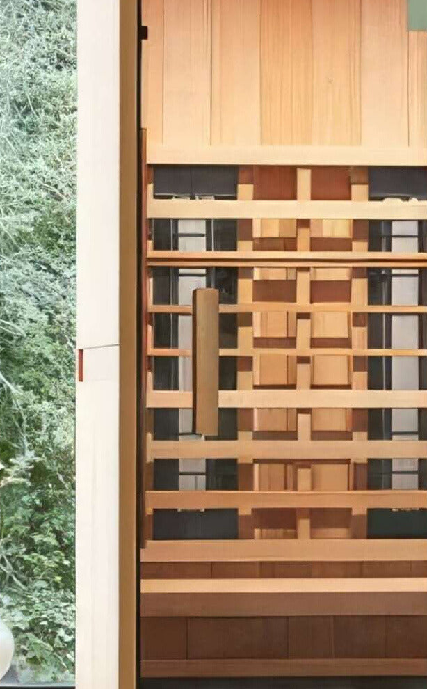 Inside the Finnmark FD-1 infrared sauna, showing the cedar bench, the backrest and the infrared panels