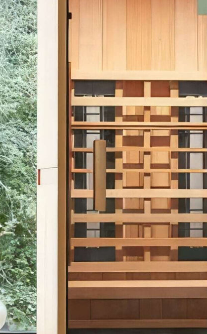 Inside the Finnmark FD-1 infrared sauna, showing the cedar bench, the backrest and the infrared panels
