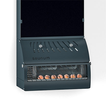 Close-up of the Saunum AirSolo base with air grille, control knobs and Himalayan salt spheres