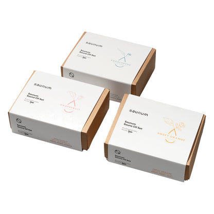 Three Saunum sauna oil set boxes: Eucalyptus, Grapefruit and Sweet Orange, on white