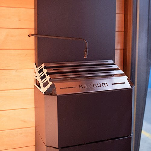 Saunum AutoLeil pipe running down the side of a Saunum heater