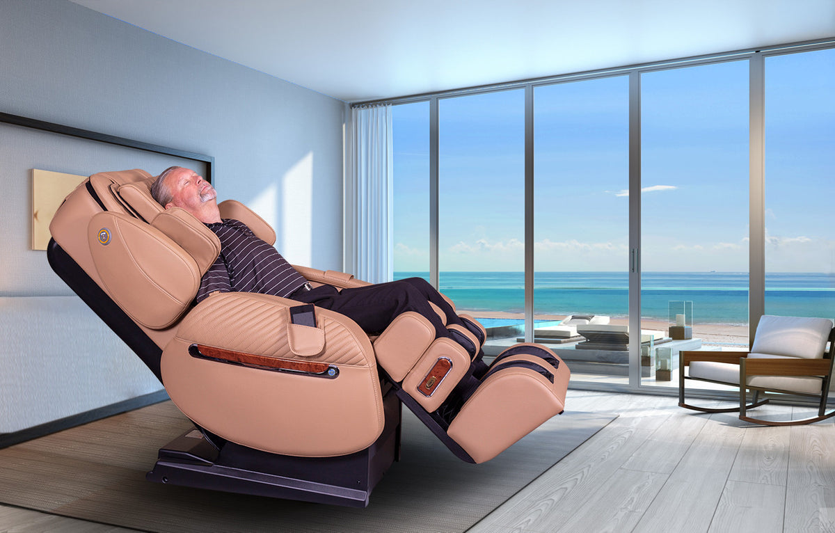 Luraco i9 Max Plus in cream fully reclined in a room overlooking the ocean