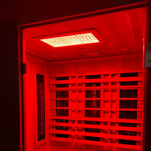 The Spectrum LED ceiling panel inside the Finnmark FD-4 Trinity sauna set to red