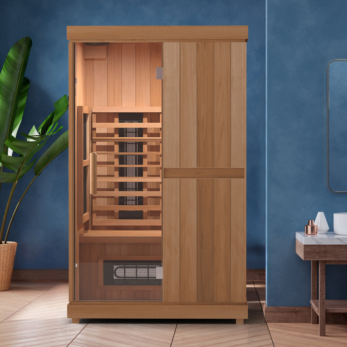 Finnmark FD-2 infrared sauna installed against a deep blue bathroom wall next to a twin basin vanity