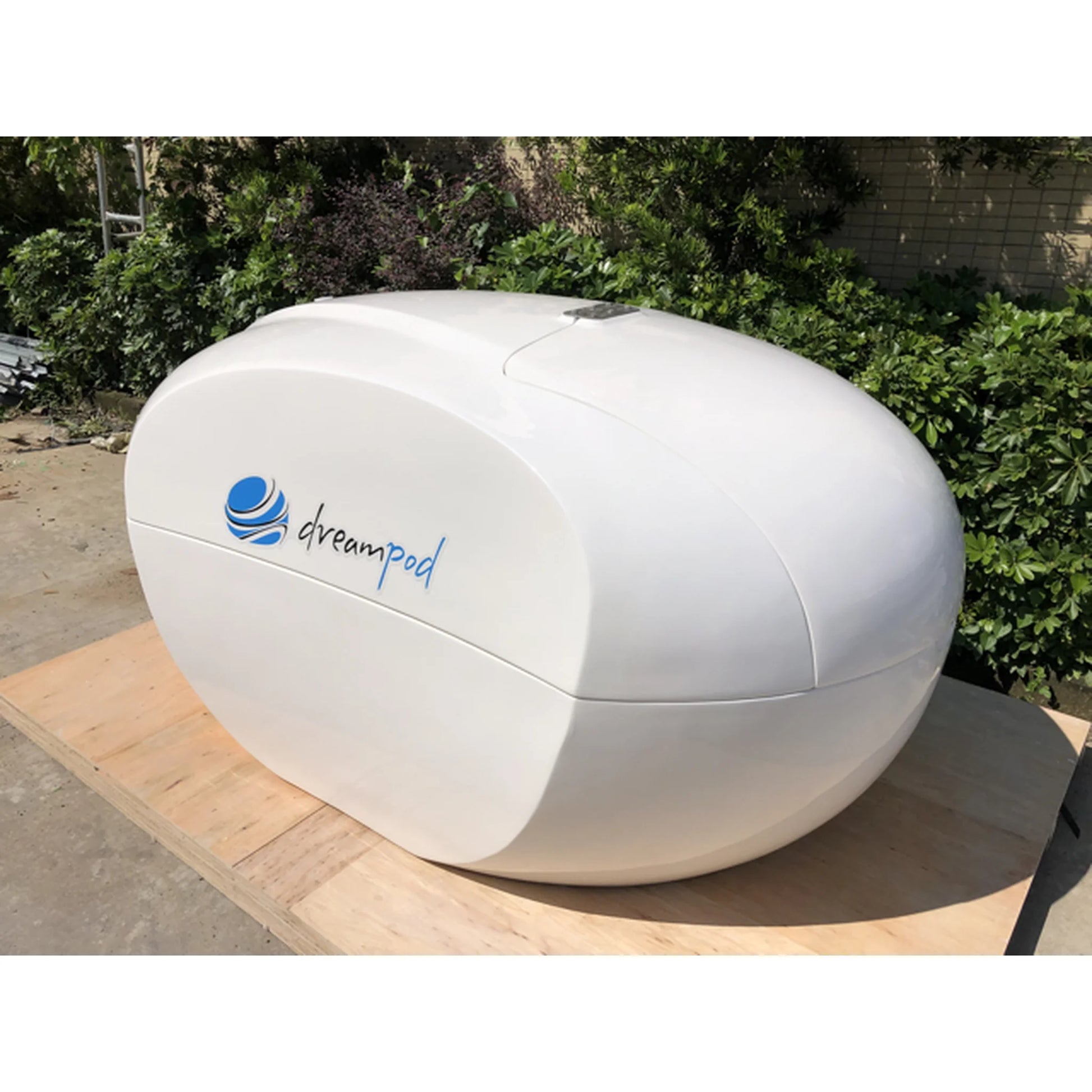 Dreampod Home Float Plus — closed white fiberglass pod