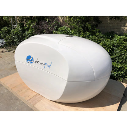 Dreampod Home Float Plus — closed white fiberglass pod