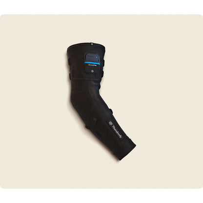 Therabody RecoveryPulse Arm worn on arm — lifestyle recovery use