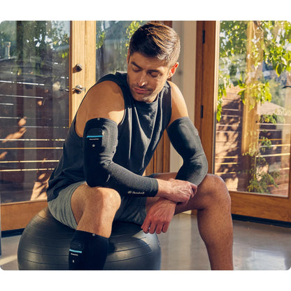 Therabody RecoveryPulse Arm — portable wearable compression sleeve in active use