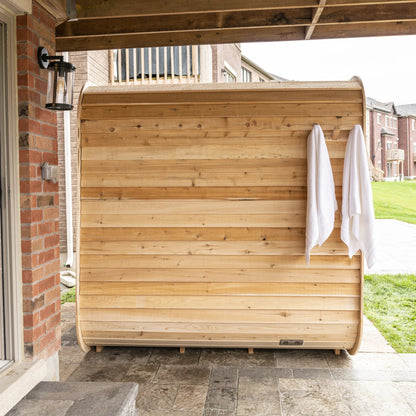 CT Luna sauna installed under a covered deck area with a towel hung beside the door
