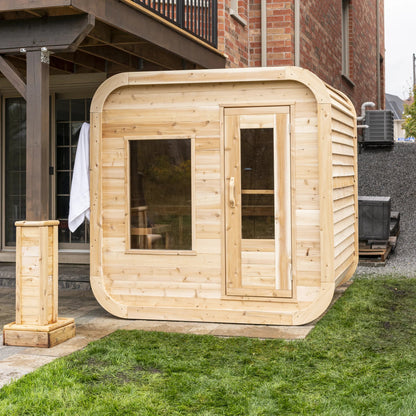 CT Luna cedar sauna from a rear three quarter angle showing the solid back wall and roof line