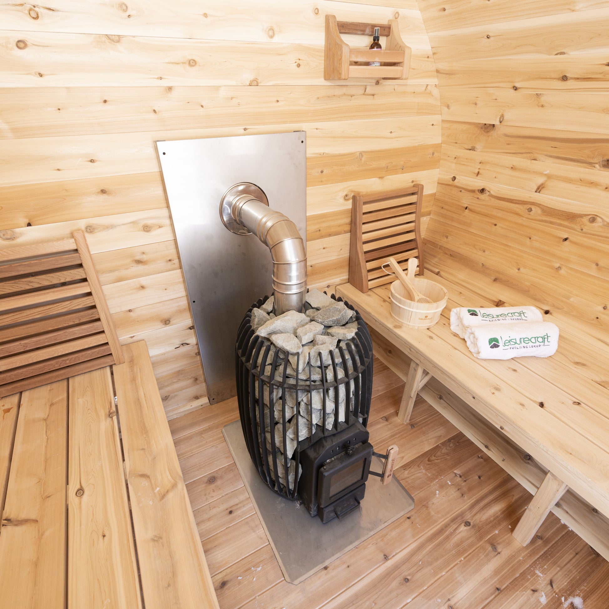 CT Elation interior from the bench, showing the heat shield, stove pipe and cedar backrests