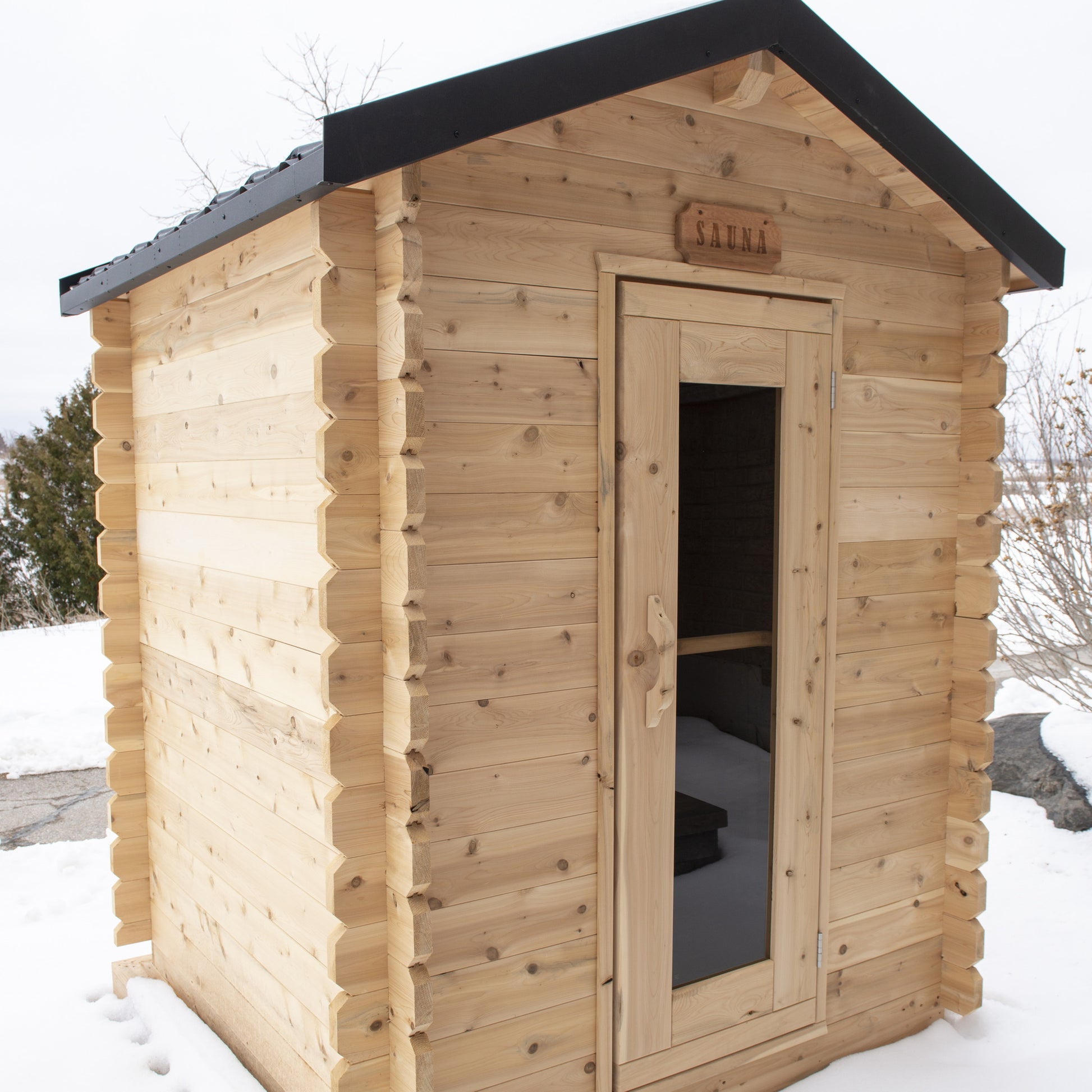 CT Granby cabin sauna from the right side in a snowy yard