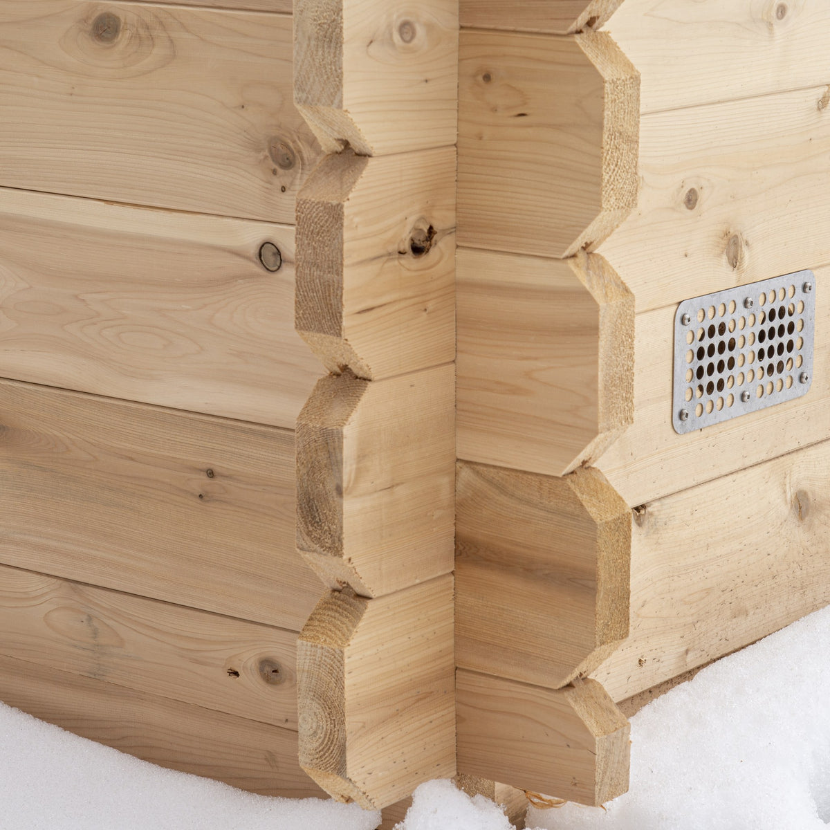Interlocking cedar corner joint and exterior vent detail on the CT Granby cabin sauna