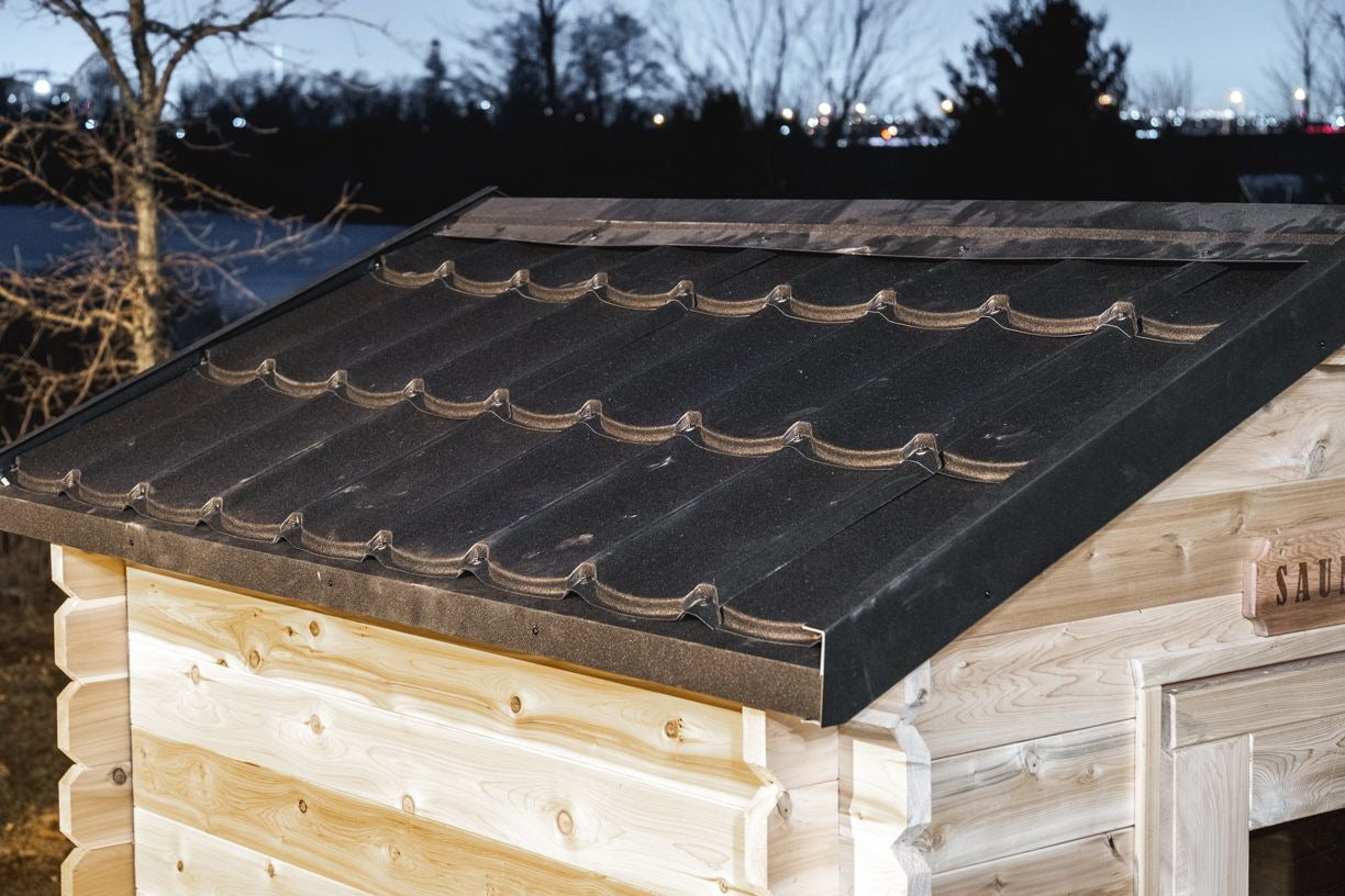 Metal shingle roof detail on the CT Granby cabin sauna at dusk