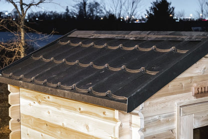 Metal shingle roof detail on the CT Granby cabin sauna at dusk