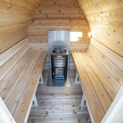 Interior of the CT MiniPOD sauna looking toward the heater with benches on both sides