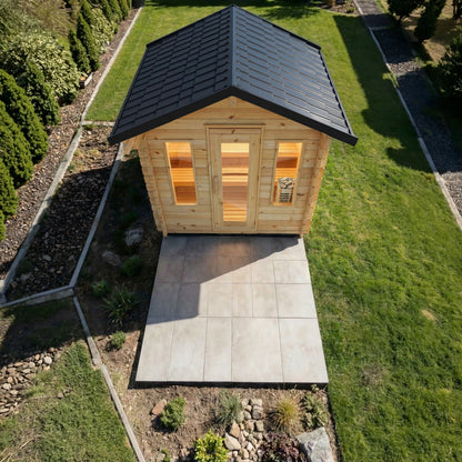Overhead view of the CT Palmer cabin sauna showing the gable metal roof and patio pad