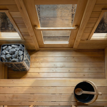 Heater stones and bucket in the CT Palmer cabin sauna, seen from above