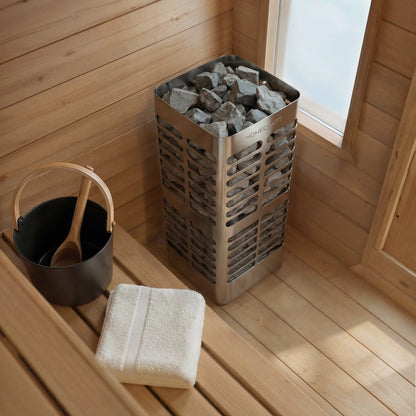 Electric heater, bucket and ladle inside the CT Palmer cabin sauna