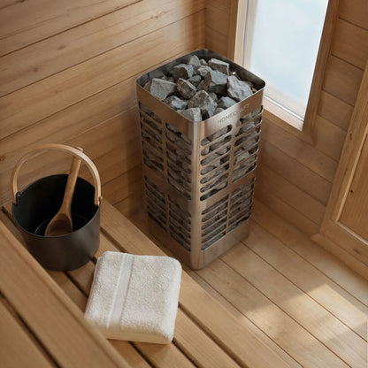 Electric heater, bucket and ladle inside the CT Palmer cabin sauna