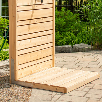 Side view of the base of the CT Savannah: the stainless L bracket at the foot of the panel and the 1 by 6 cedar floor boards of the pad