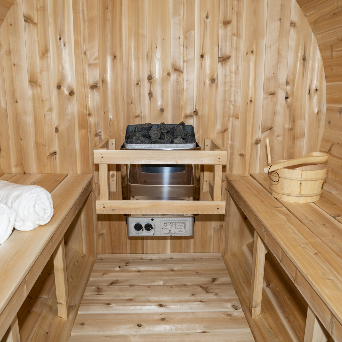 Inside the CT Serenity: two facing cedar benches and the electric heater at the back wall