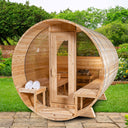 CT Serenity MP barrel sauna with the halfmoon panorama glass front around the door, towels on the porch benches