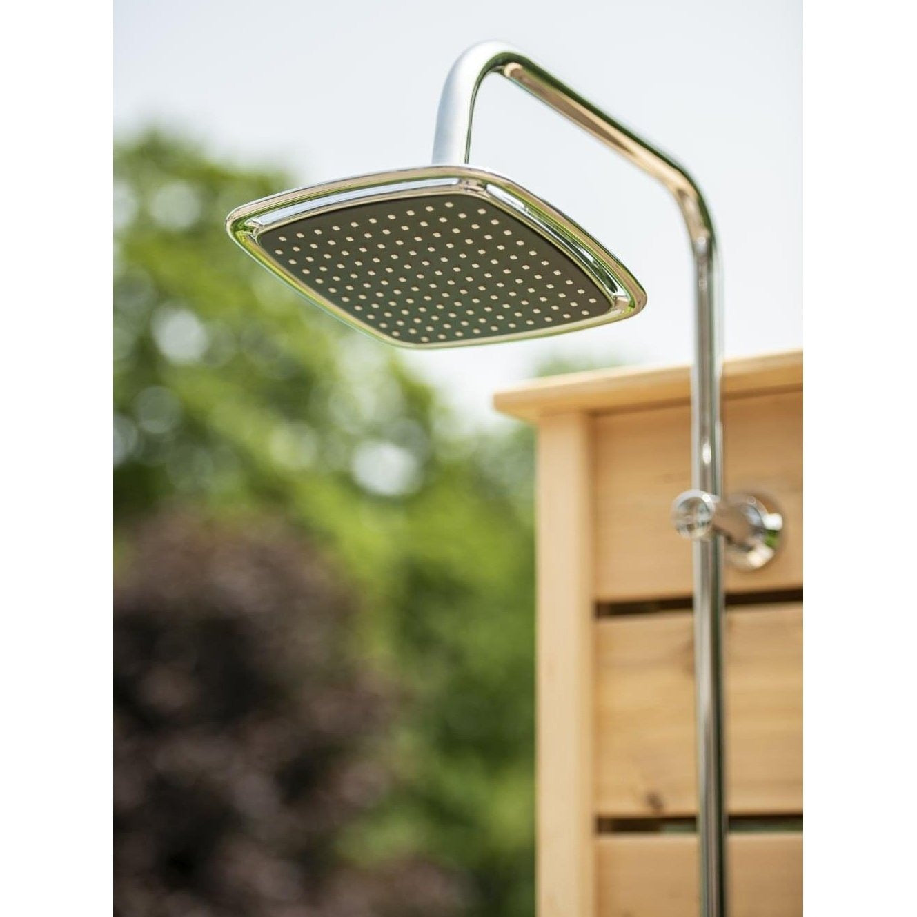 Square chrome rain head, not running, on the chrome riser at the top of the Sierra pillar, sold separately from the shower.