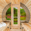 CT Tranquility MP barrel sauna seen from inside, glass panorama front around the door looking onto a garden