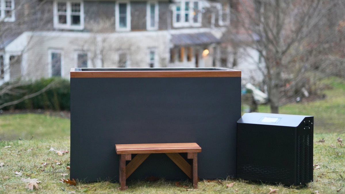 DCT Cuboid Plastic cold plunge with cedar bench and chiller, on a lawn