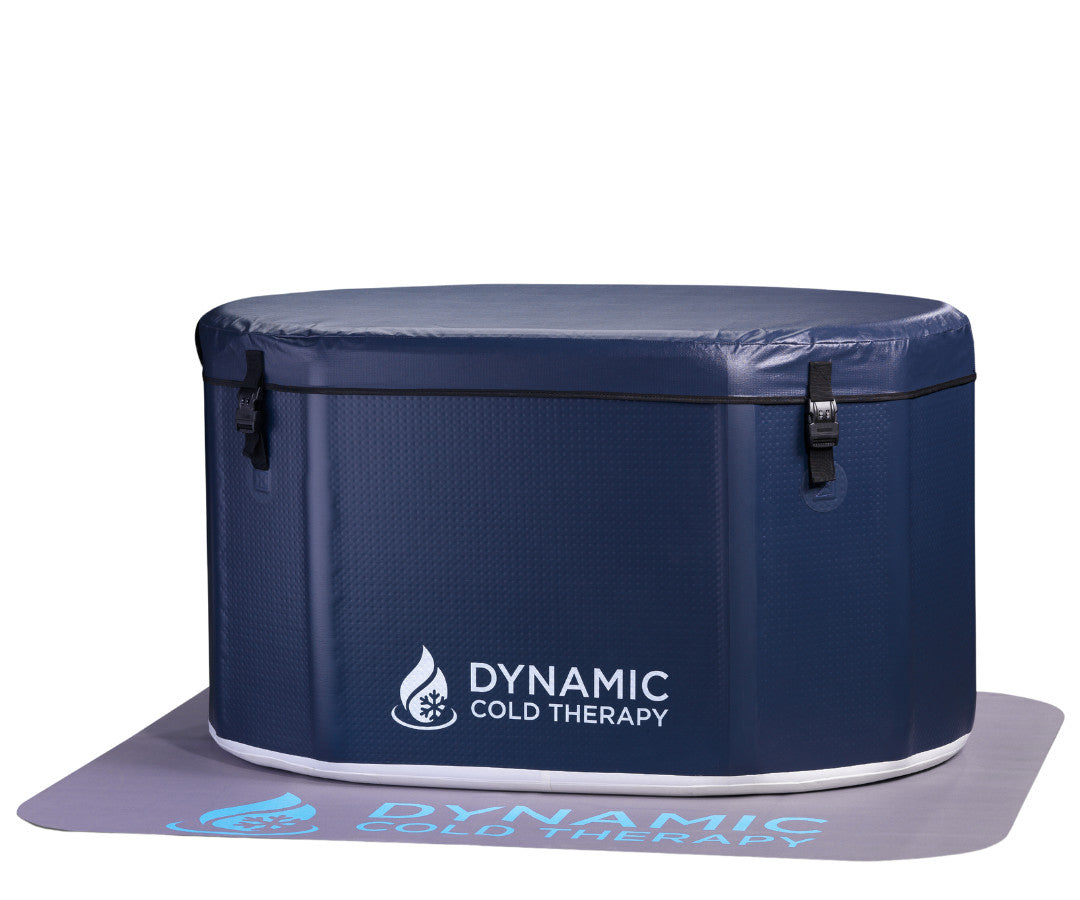 Dynamic Cold Therapy oval inflatable cold plunge with insulated cover on its floor mat
