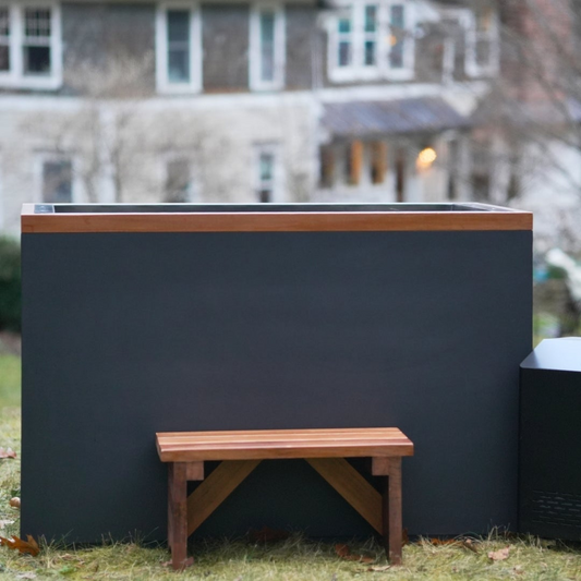 Dynamic Cold Therapy Cuboid XL stainless steel cold plunge with cedar bench and chiller on a lawn