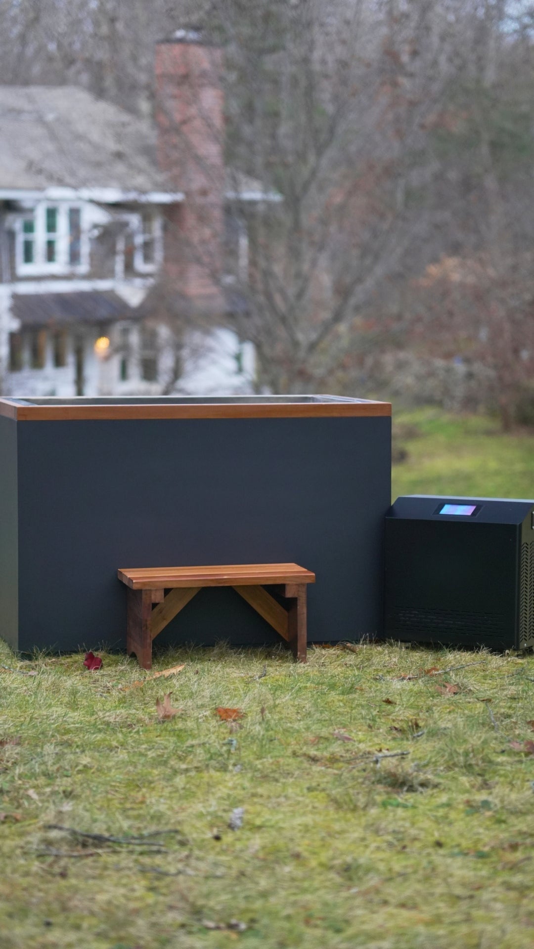 DCT Cuboid stainless cold plunge with cedar bench and chiller, outdoors
