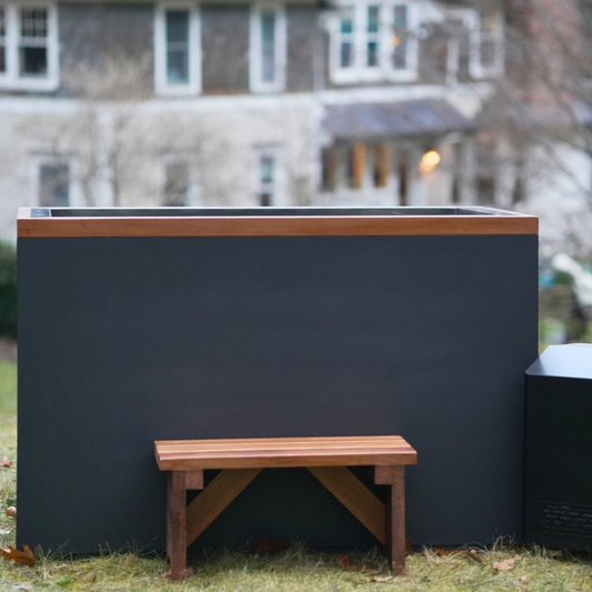 Dynamic Cold Therapy Cuboid stainless steel cold plunge with cedar bench and chiller on a lawn