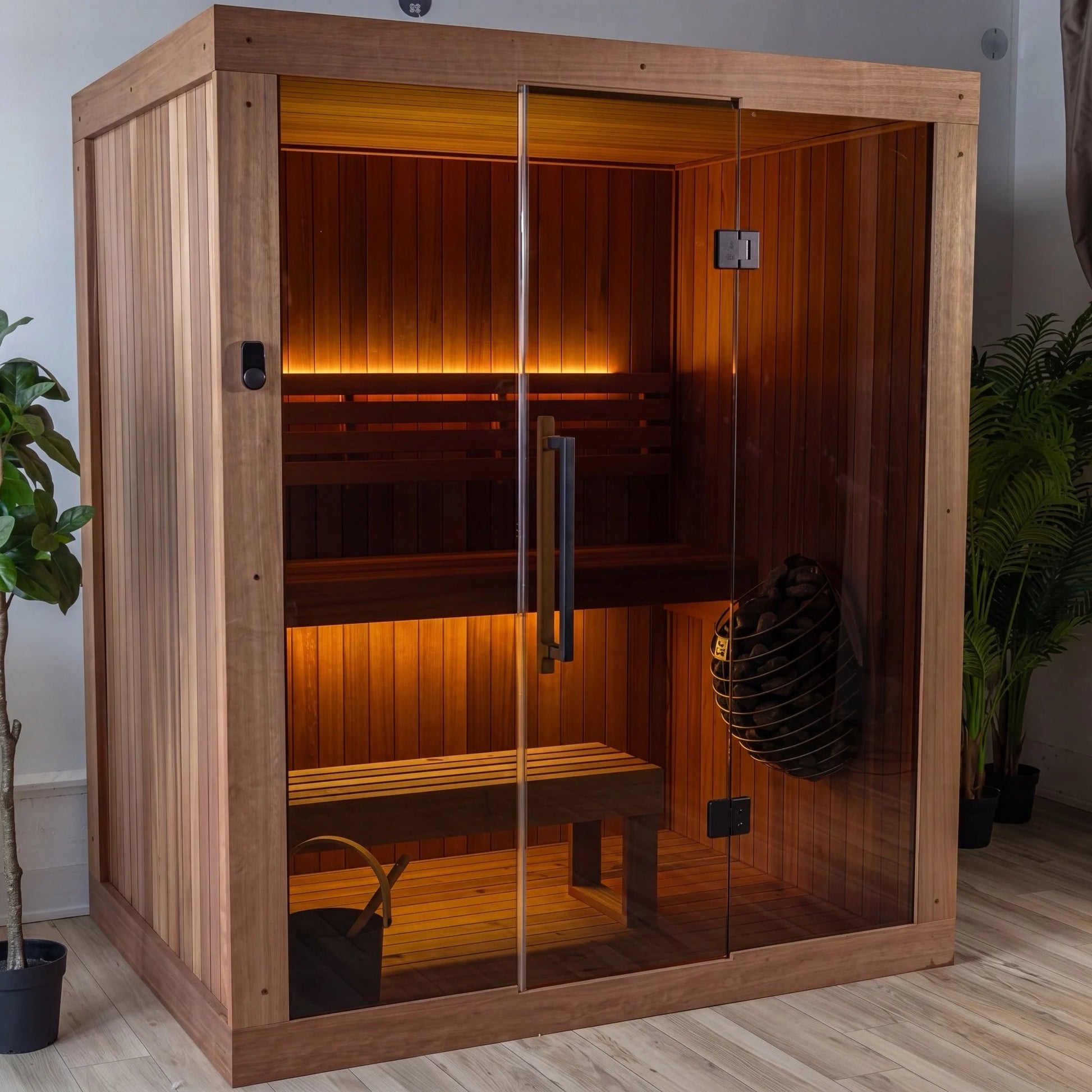 CT Element Loft indoor sauna from an angle, showing the glass front and Thermo Grandis frame